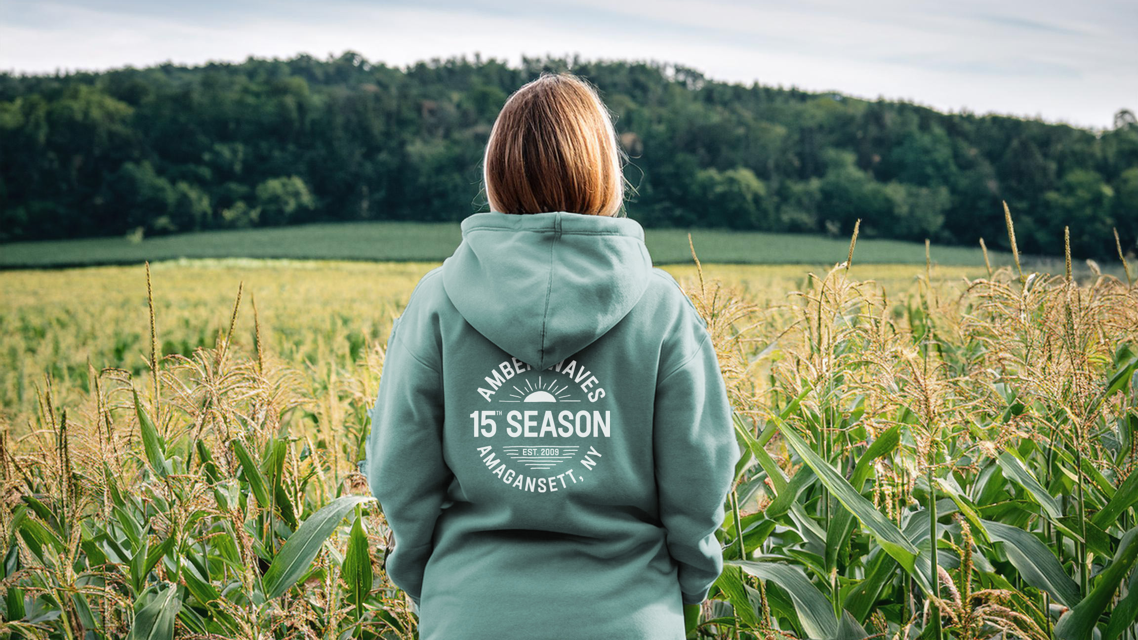 Firefly Back of woman standing on a farm with corn field, wild flowers, forest in background facing  (4)_4